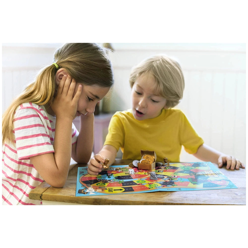KidzLabs Treasure Island Dig & Play game being enjoyed by two children with colorful game pieces on a wooden table.