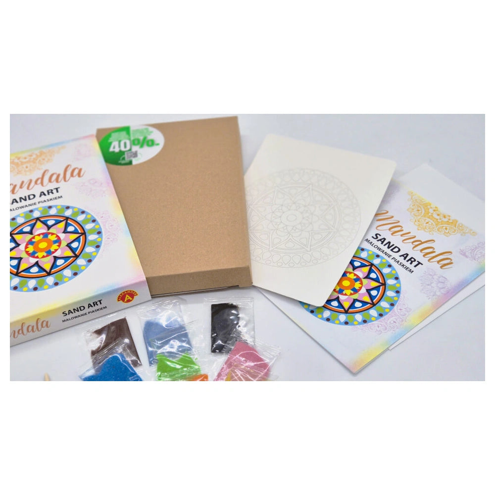 Sand art kit featuring a cardboard box, patterned paper, and colorful sand bags for creative projects.