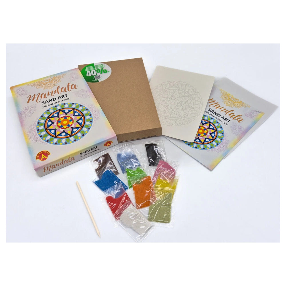 Sand art mandala kit featuring colorful sand pieces, a wooden stick, and instructions in Devanagari script on a white surface