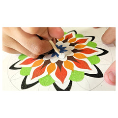 Alexander Sand Art Mandala 3 showcases hands applying vibrant, glittery colors to a floral-patterned surface for a craft proj