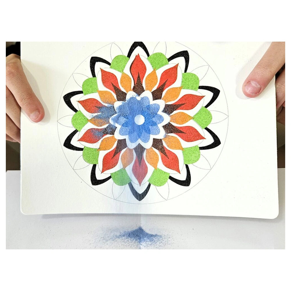 Sand Art Mandala features a colorful, symmetrical flower design on textured white paper held by a person's hands.