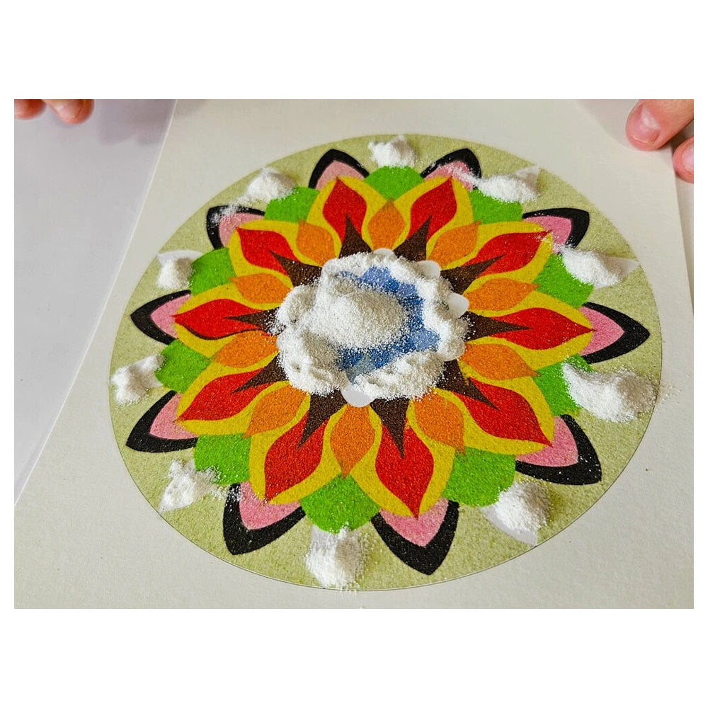 Sand Art Mandala features a colorful flower design with petals in red, yellow, green, and blue on a light surface.