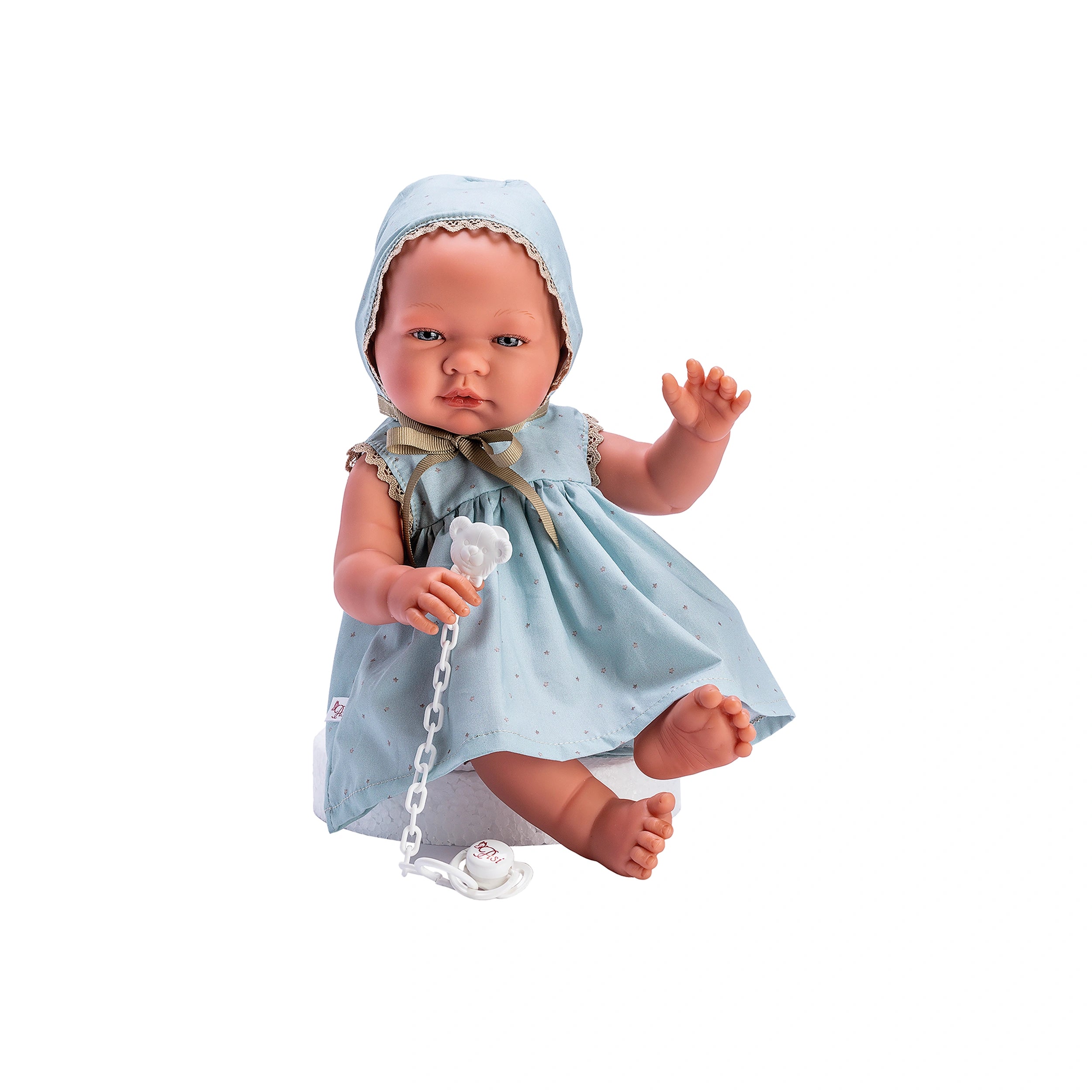 ASI Dolls María in a blue star dress with matching bonnet, holding a white pacifier chain.