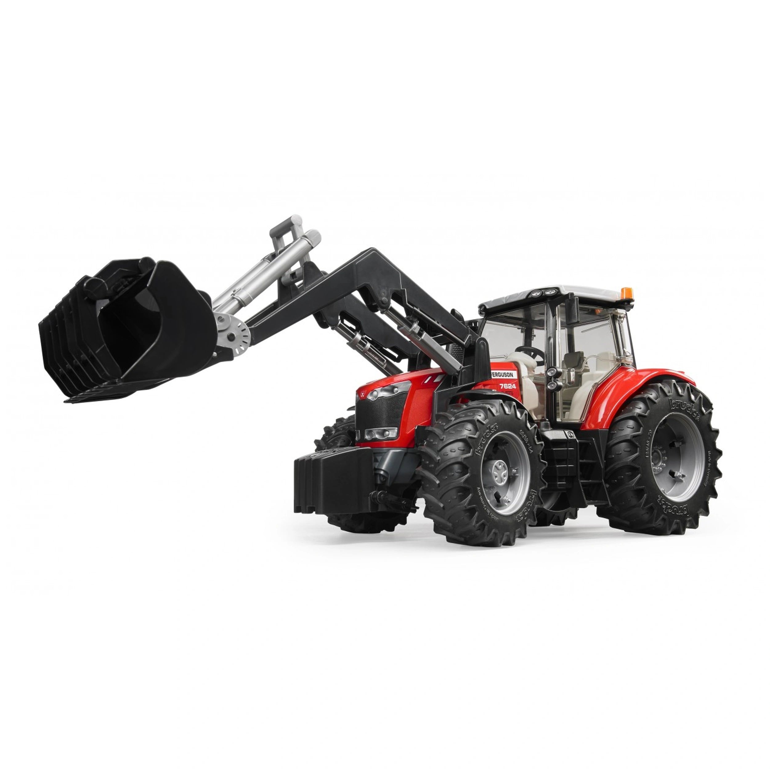Red toy tractor with large black tires and a functional front loader, showcasing realistic agricultural equipment.