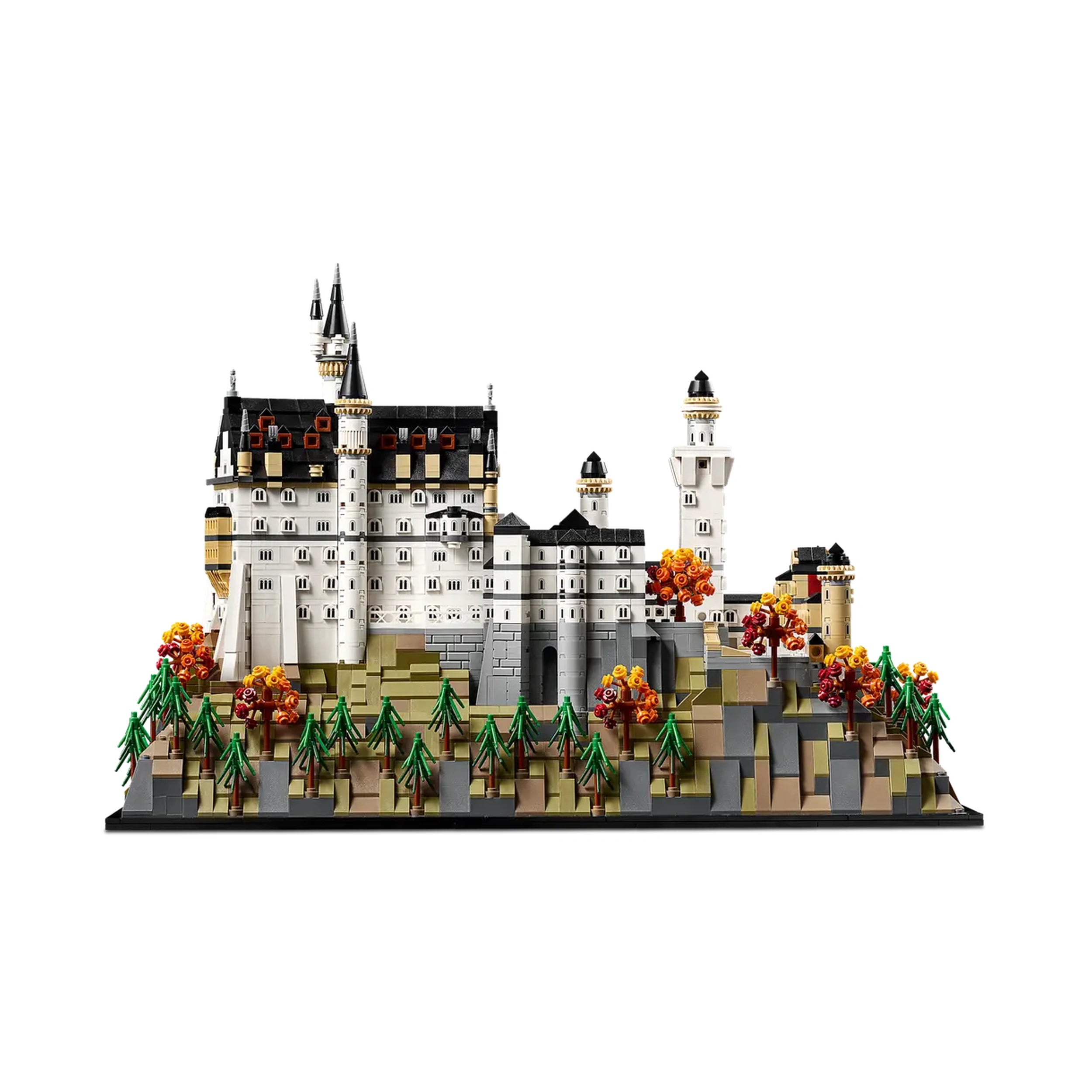 LEGO Architecture Neuschwanstein Castle set with detailed spires, turrets, and colorful foliage on a rocky base, showcasing intricate architectural features.