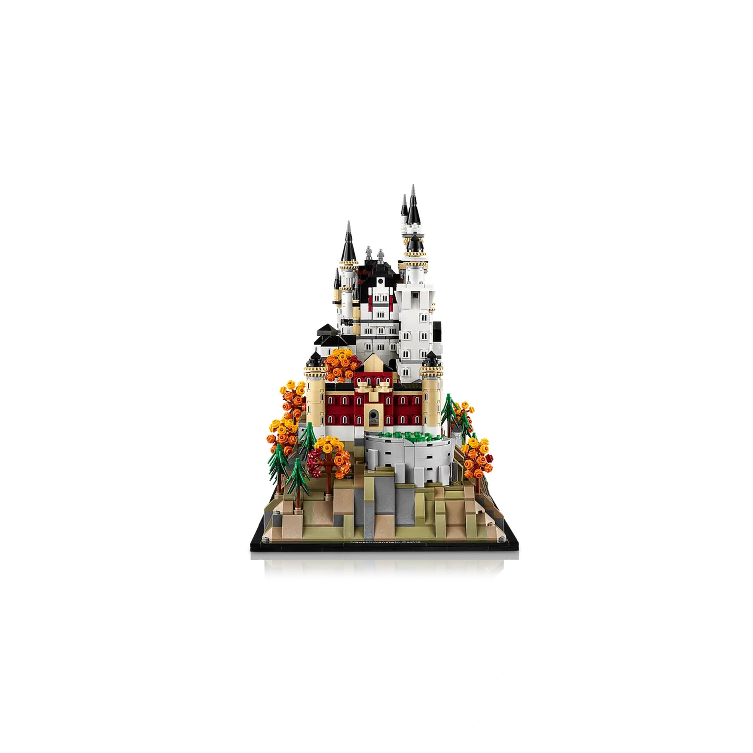 LEGO Architecture Neuschwanstein Castle model featuring intricate details, towering spires, and vibrant landscaping with orange flowers.