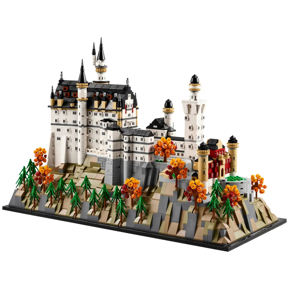 LEGO® Architecture Neuschwanstein Castle model featuring intricate details, towering spires, and colorful trees on a rocky base.