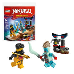 Two LEGO minifigures, Arin and a Spectral Dragonian, face off with a sword and staff. A detailed construction piece with a moving winch sits nearby. The colorful packaging features the NINJAGO logo and elements from the Dragons Rising TV series.