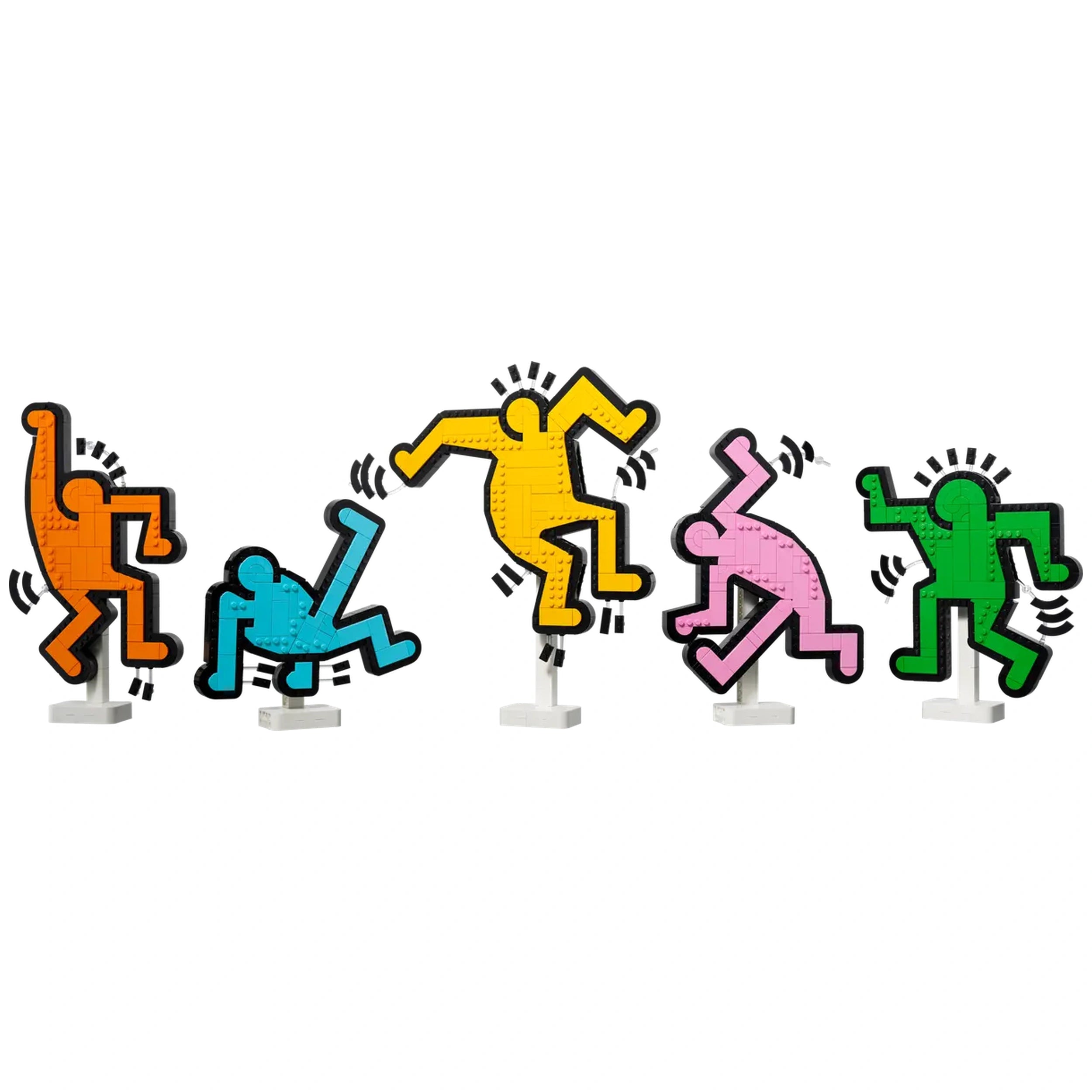 Five colorful LEGO figures inspired by Keith Haring's art, displaying energetic dance poses in orange, blue, yellow, pink, and green against a white background.