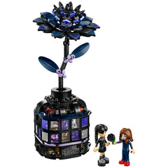 LEGO Black Dahlia Flower set featuring a black flower atop a mini conservatory vase, with two characters exchanging a flower.