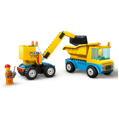 Construction set featuring a yellow crane truck and a blue dump truck, with a worker minifigure holding a remote control.