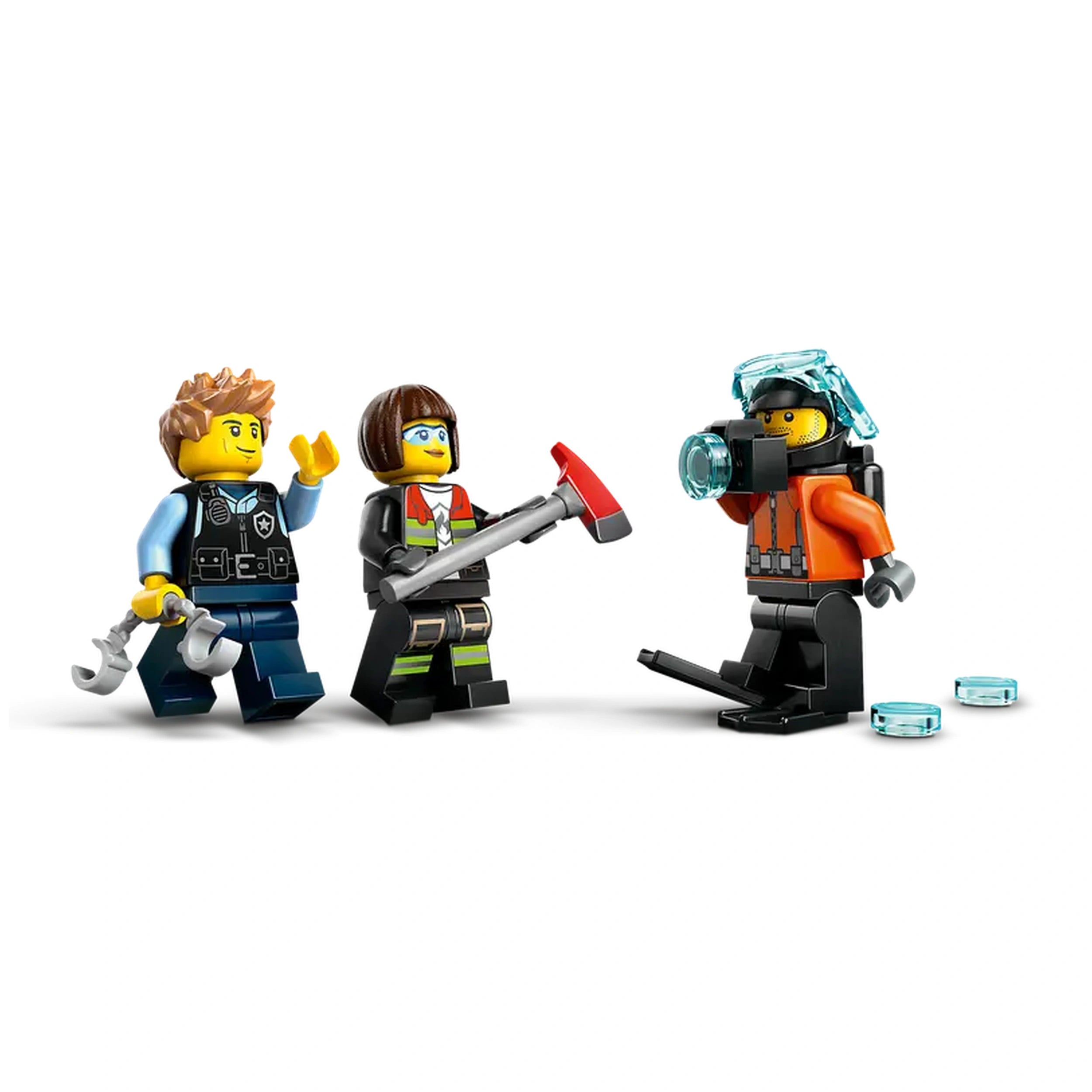 Three LEGO minifigures stand together, ready for adventure. On the left, a policeman with a wrench smiles, next to a girl in a green outfit holding a red tool. On the right, a diver in an orange suit wears a helmet and holds a camera, with transparent blue discs scattered on the ground.