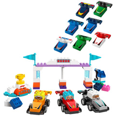 Colorful Lego Duplo F1® Team Race Cars set featuring two cars in orange and red, a starting light structure, a trophy stand, and various interchangeable car parts in multiple colors.
