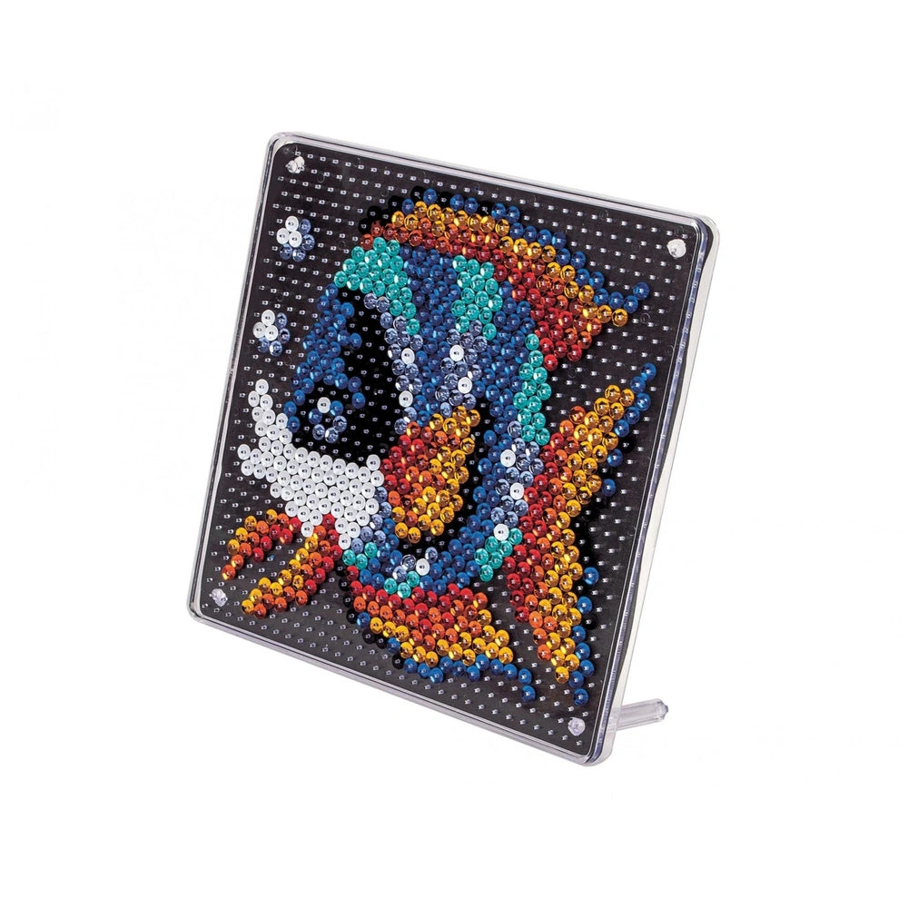 A decorative fish design made of glossy materials features colorful, reflective beads mimicking fish scales.