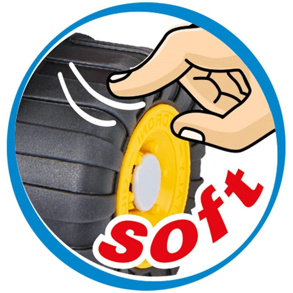 Hand pressing soft black tire with yellow center, labeled "soft" in red text.
