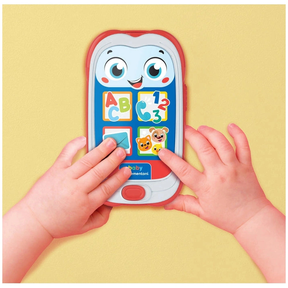 Colorful Baby Clementoni smartphone held by a child, featuring educational content with letters, numbers, and a friendly face