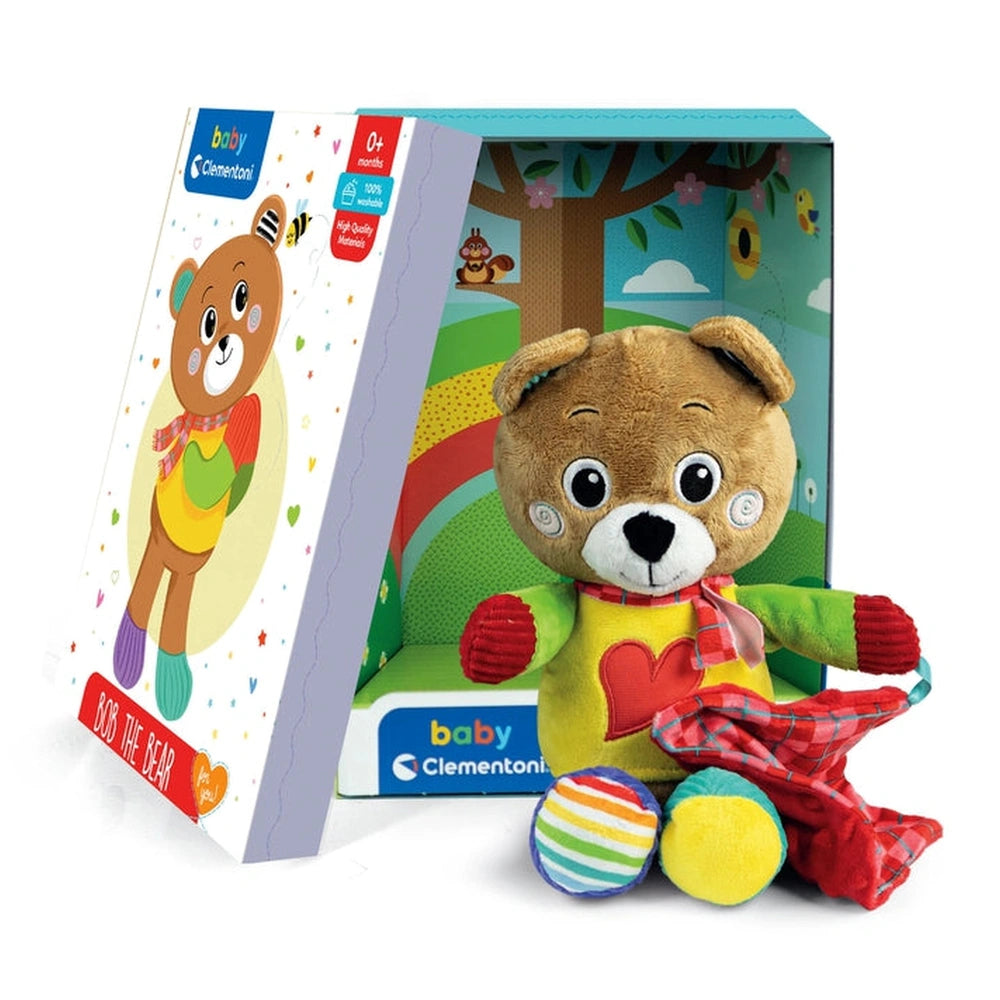Baby Clementoni Bob The Bear plush toy with a colorful book, designed for infants aged 0-4 months, in playful packaging.