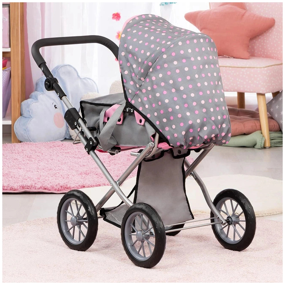 BAYER DESIGN Dolls Pram City Star features a metallic frame, pink polka dot seat cover, and black wheels on a light pink carp