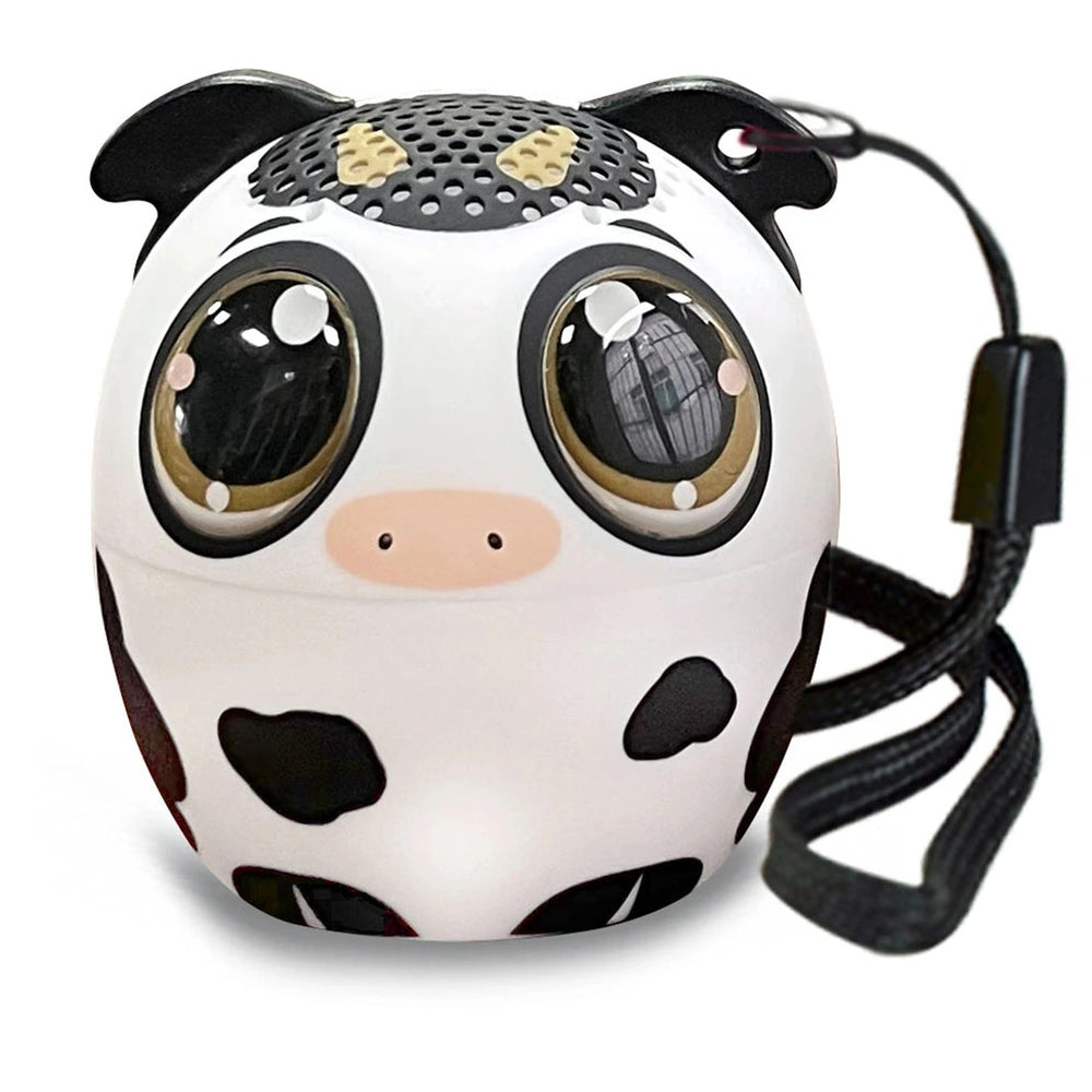 Bontempi mini wireless speaker shaped like a white cow with black spots, featuring transparent eyes and a black cord.