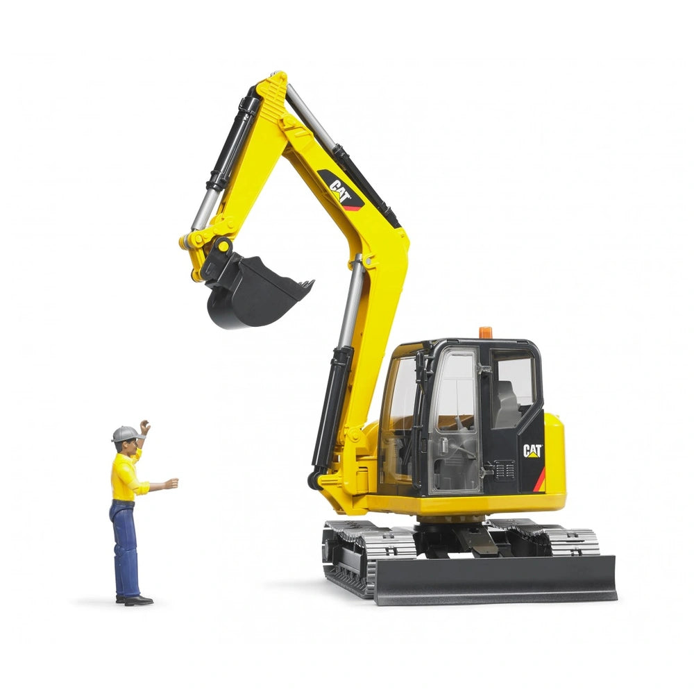 Yellow CAT mini excavator toy with realistic details and a worker figure in a hard hat nearby.