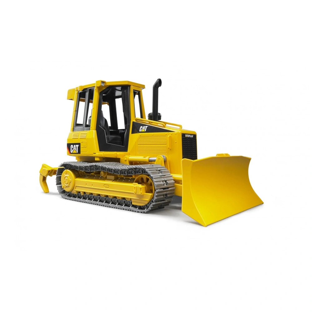 Yellow Bruder CAT track-type tractor toy with black details, adjustable blade, and detachable ripper, viewed from the side.