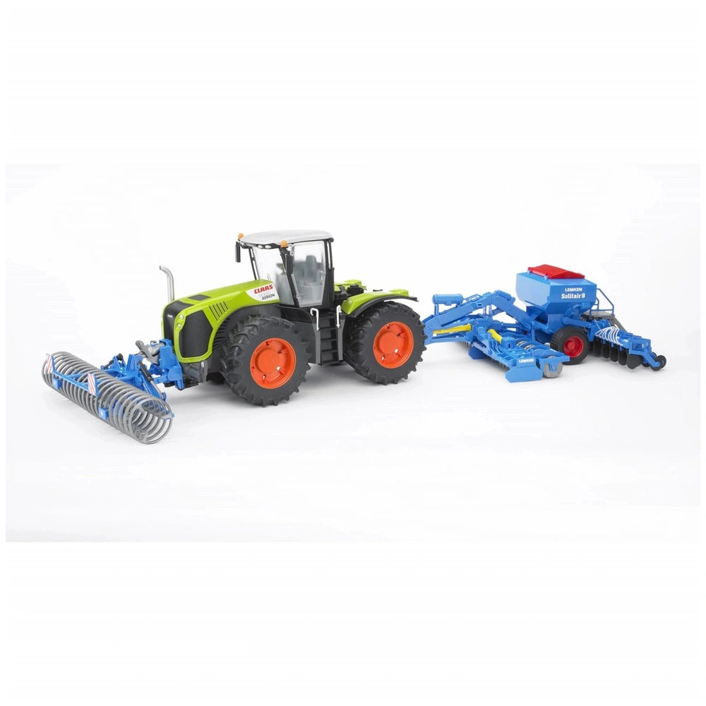 Claas Xerion 5000 toy tractor with green body, orange wheels, and blue farm equipment attachment, 1:16 scale model.