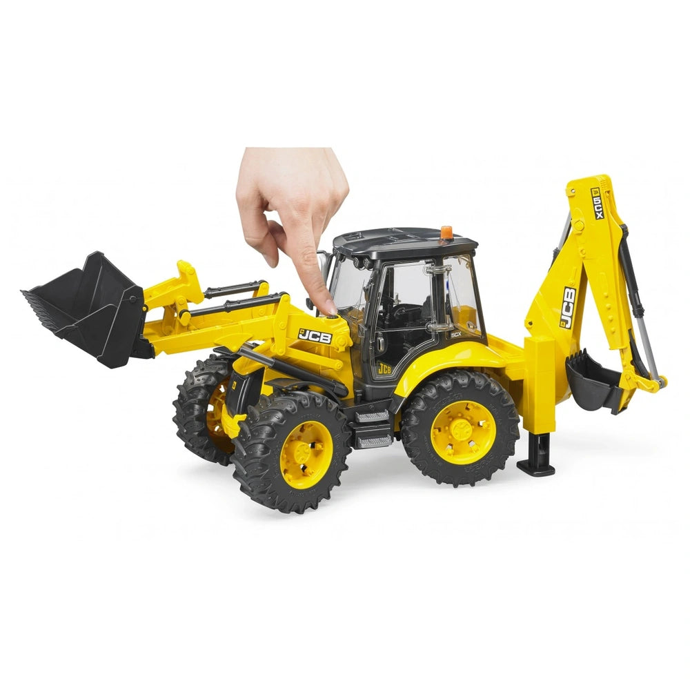 Yellow Bruder JCB 5CX eco Backhoe Loader toy with movable front bucket and rear excavator. Finger interacting with controls.