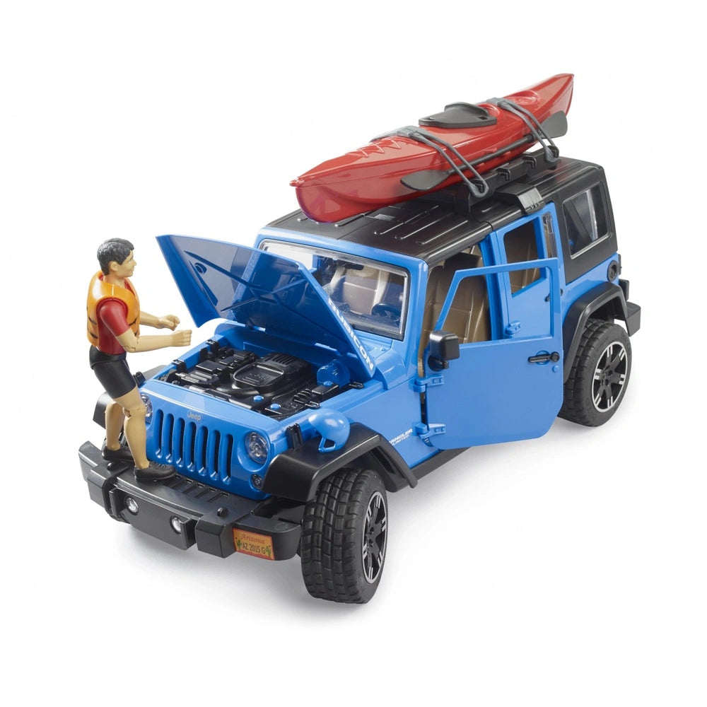Blue Jeep Wrangler toy with open doors and hood, red kayak on top, and lifelike kayaker figure in yellow vest.