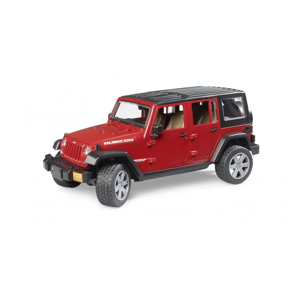 Red Bruder Jeep Wrangler Unlimited Rubicon toy vehicle with black roof and rugged tires.