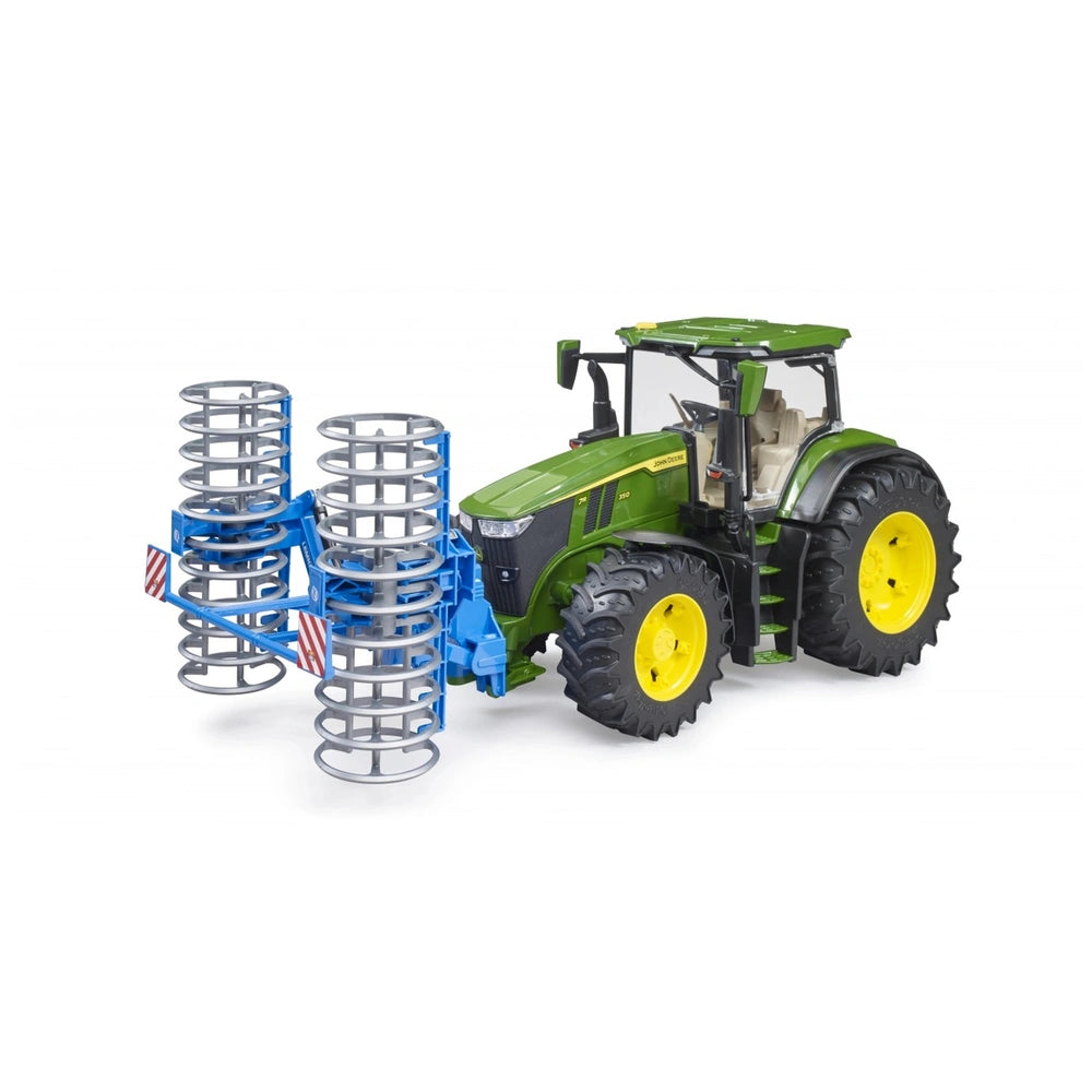 Green Bruder John Deere 7R 350 toy tractor with large yellow wheels and a blue dual drum roller attachment.