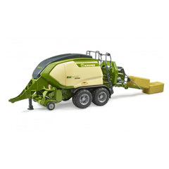 Bruder Krone Big Pack 1290HDP toy baler in green and beige, featuring dual wheels and two block hay bales.