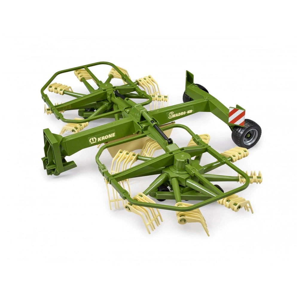 Green and beige Bruder Krone Dual Rotary Swath Windrower toy with realistic farm machinery details.