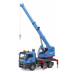 Bruder MAN TGS crane truck with extended blue crane, red stabilizers, and detailed cab on white background.