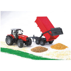 Red Massey Ferguson 7480 toy tractor with tipping trailer, displaying detailed features, surrounded by grains and fodder.