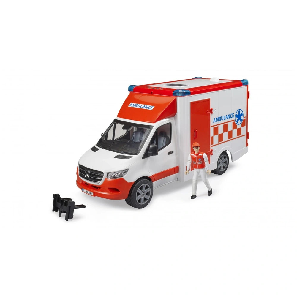 Red and white toy ambulance with lifeguard figure, detailed front cab, and side medical star emblem.
