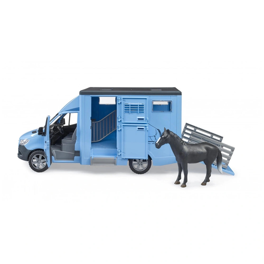 Blue toy vehicle with open doors and ramp, revealing an inner compartment. Includes a black horse figure beside the transporter.