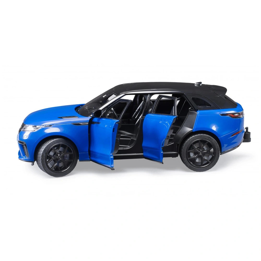 Blue Bruder Range Rover Velar toy car with doors open, black roof, and detailed interior.