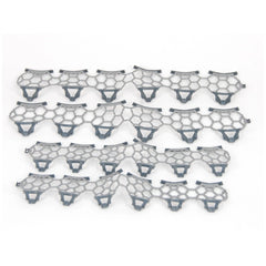 Snow chains set for Claas Axion 950 toy vehicle, featuring interlocking hexagonal gray and black patterns.