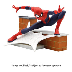 Bullyland Spider-Man action figure in red and blue suit, dynamic pose on textured white surface against glossy brick wall.