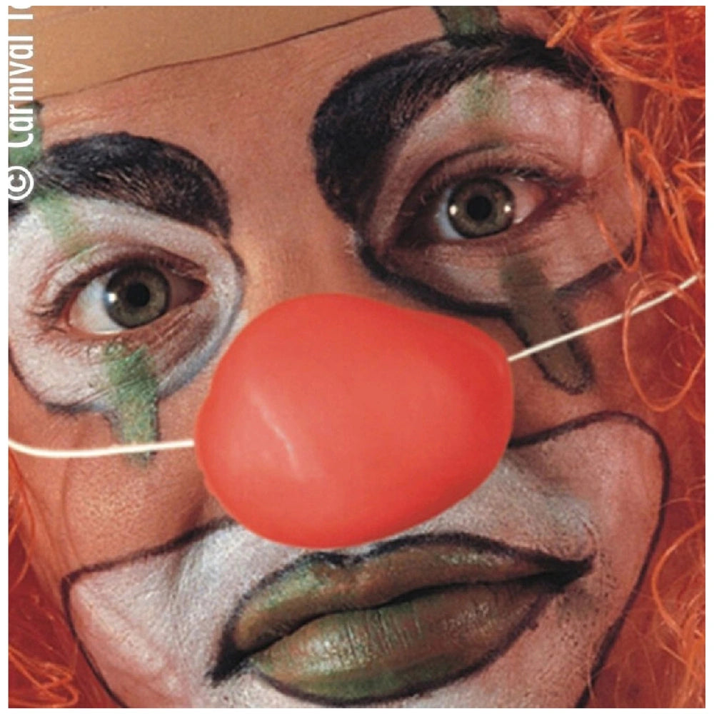 Big clown nose in glossy red plastic with matte finish, surrounded by vibrant green and white eye shadows for dress-up fun.
