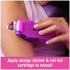 Cool Maker Shimmer Me Body Art Set showcases a vibrant heart-shaped sticker on a person's upper arm with colorful designs.