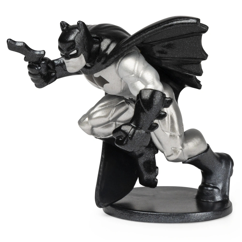 DC Comics BATMAN collectible mini figure stands in a dynamic pose, featuring a glossy black finish and a cape.