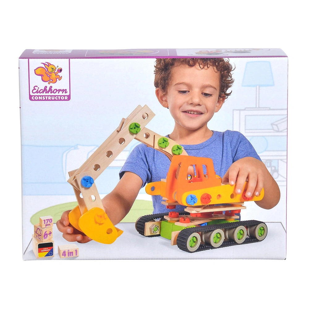 Eichhorn construction toy held by a smiling child in a blue t-shirt, featuring orange and yellow components on a light backgr