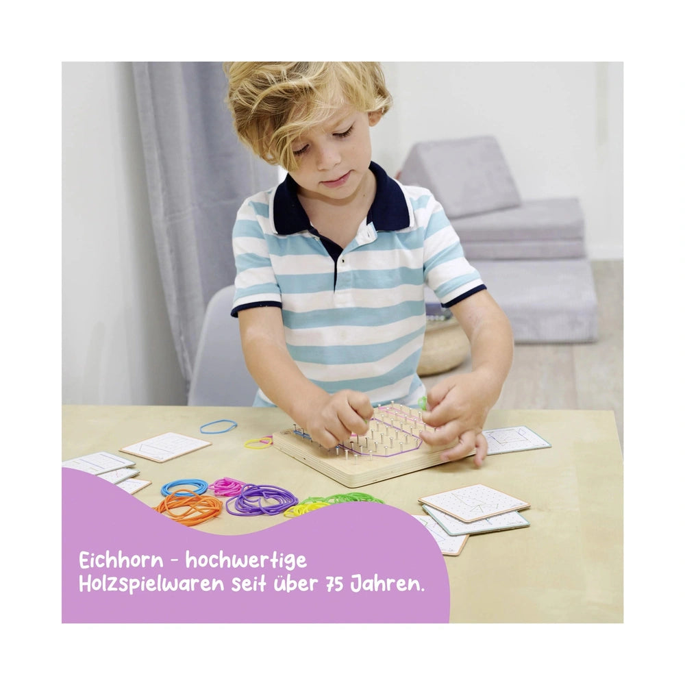 Eichhorn Montessori Geometry Board with a boy using colorful strings and wooden pegs for a craft activity at a table.