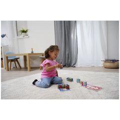 Eichhorn Picture Cube Friends set displayed with a child playing on a carpet, colorful blocks and a cozy living space in the 