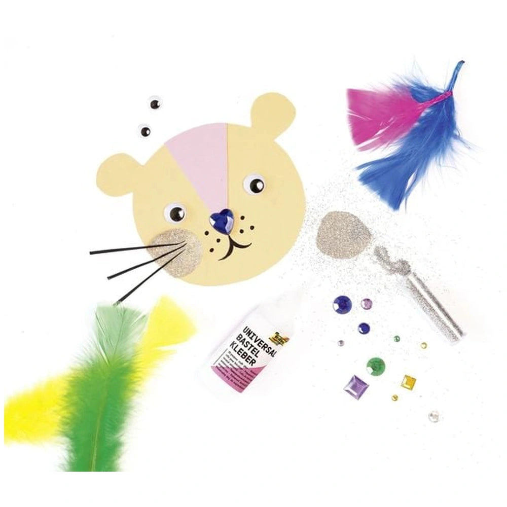 Folia Deko Mix Bastelset features 600 multi-colored craft supplies including feathers, beads, and scissors in a matte cardboa
