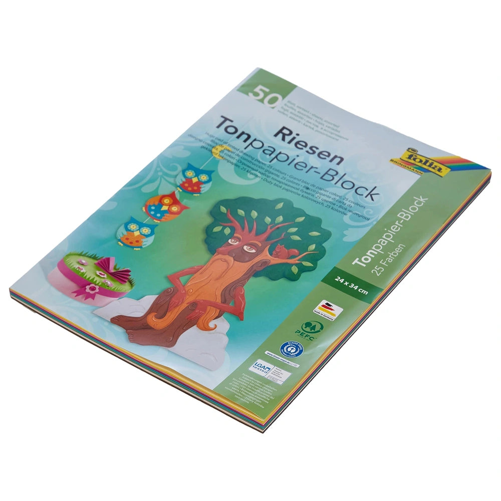 Folia Riesen Tonpapier Block A4 with 50 multi-coloured sheets features a vibrant design with trees, owls, and a sunny sky.