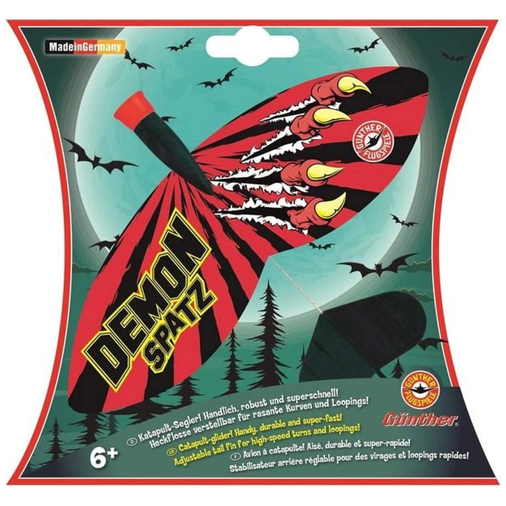Demon Spatz catapult glider packaging features a red and black bat-like graphic on a green background with bold text.
