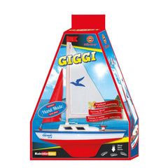 Gunther Flugspiele Giggi Sailing Boat packaging features a glossy blue background, showcasing a red and white sailboat on wat