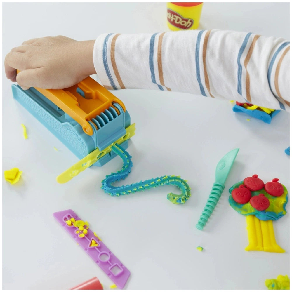 Hasbro Play-Doh Fun Factory Starter Set featuring yellow, green, and blue plastic components for creative modeling fun.
